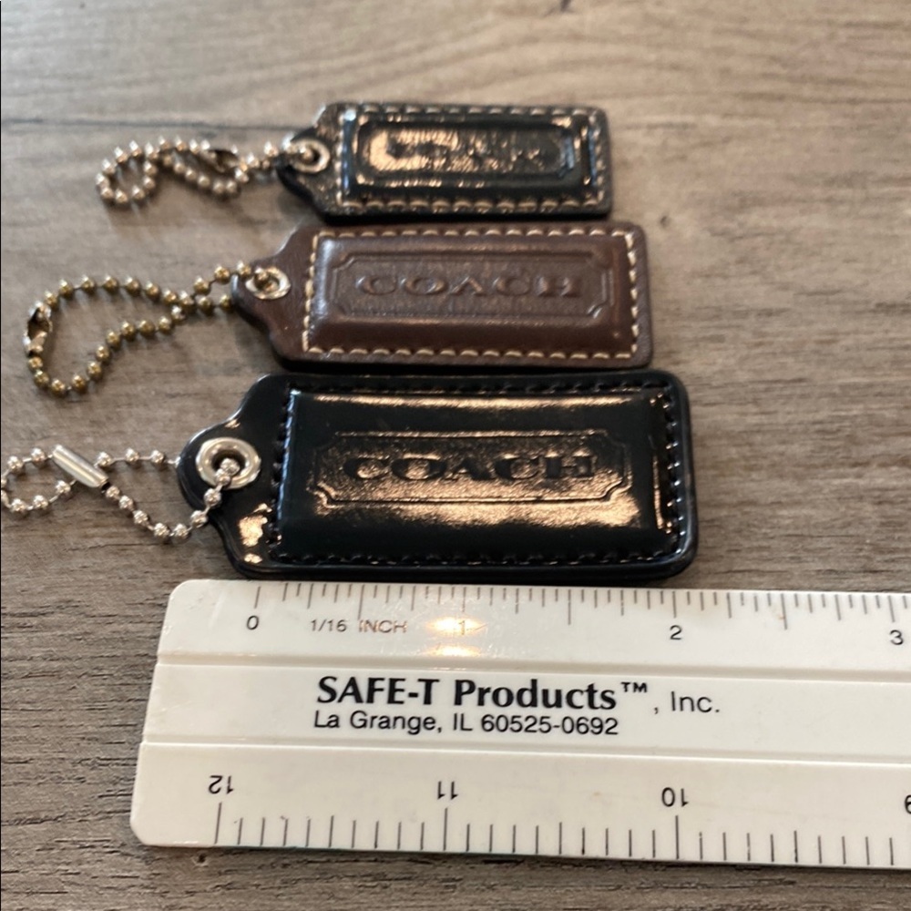Set of 3 brown Coach hang tags